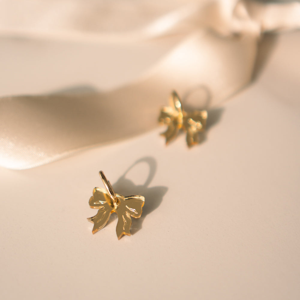 Take A Bow - korvikset - kulta